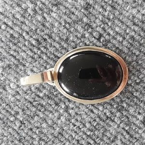 Handcrafted sterling silver and black onyx pendant